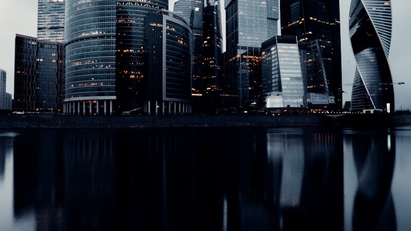 city skyline across body of water during daytime