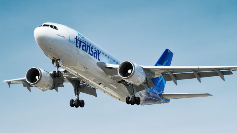 photo of gray and blue Transat airplane