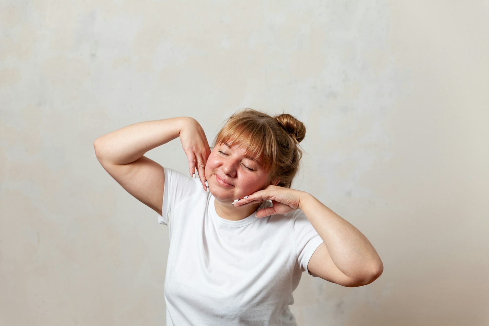 a person with the hands on the face